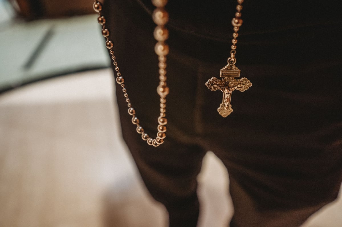 Priest with Rosary